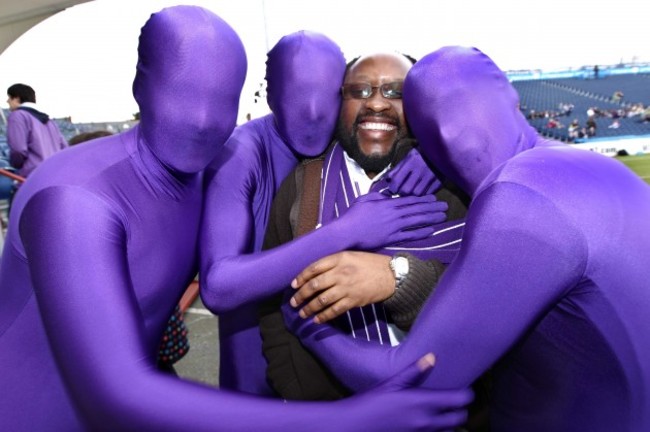 Fr Chiedza is surrounded by fans before the game