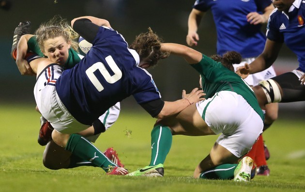 Niamh Briggs and Larissa Muldoon tackle Gaelle Mignot