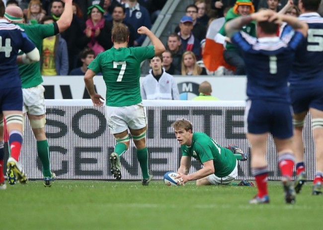 Andrew Trimble goes over for their second try as Chris Henry celebrates