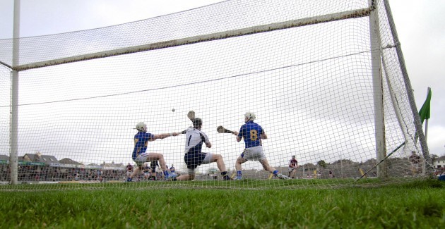 Darren Gleeson, Padraic Maher and Brendan Maher fail to stop Connor Cooney's penalty