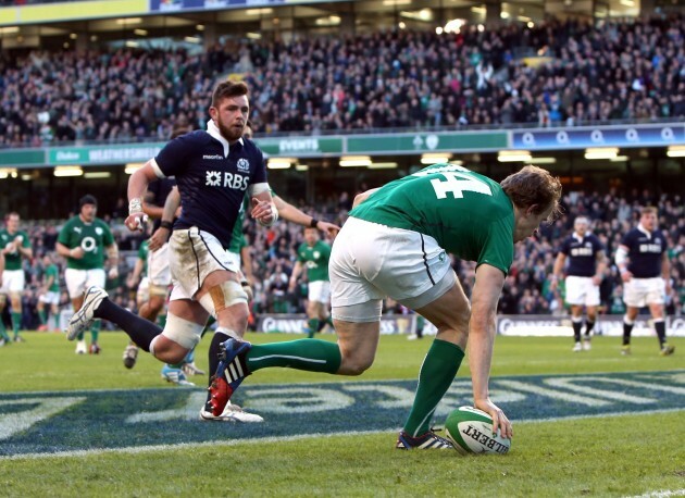 Andrew Trimble touches down for a try as Dave Denton looks on