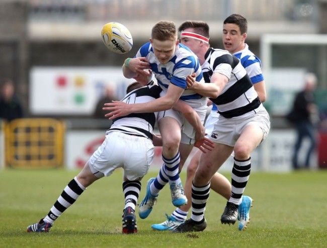 James Moriarity knocks on as he is tackled by Hugh O&Otilde;Sullivan and Max Kearney