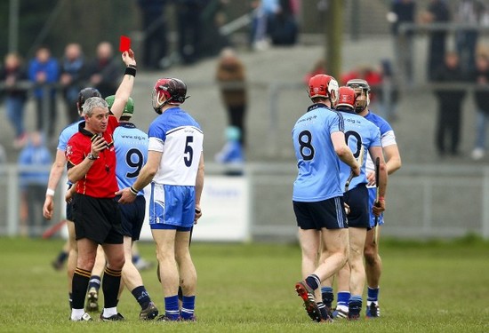 Referee Johnny Ryan shows Shane O'Sullivan a card