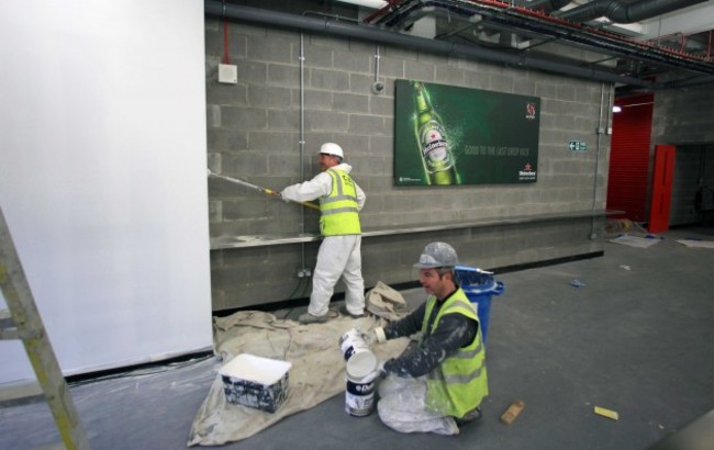 Workers put the last minute touches to the stadium