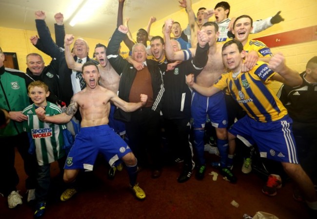 The Bray team celebrate in the dressing room after the game