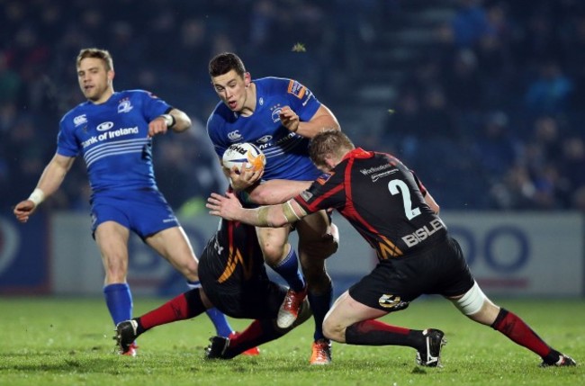 Noel Reid is wrapped up by the Dragons' defence