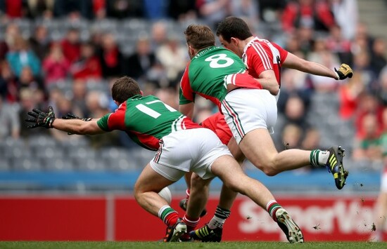 Cailean O'Boyle scores his sides opening goal despite Shane McHale and Aidan O'Shea
