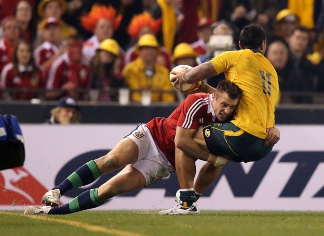 Australian Wallabies Joe Tomane  is tackled by British and Irish Lions's Tommy Bowe