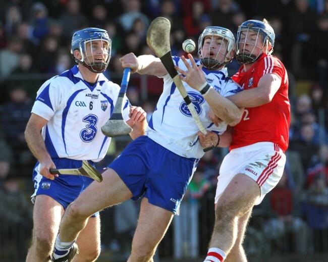 Michael Walsh and Wayne Hutchinson tackle Patrick Horgan