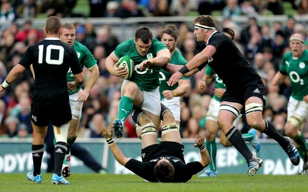 Cian Healy runs at Richie McCaw