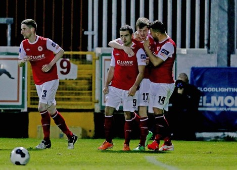Christy Fagan celebrates with teammates after scoring his second goal