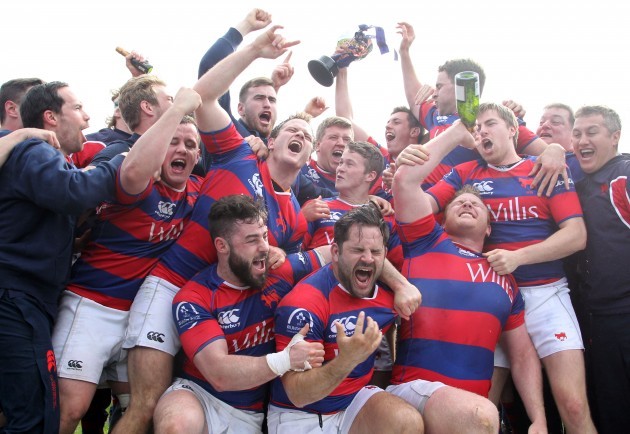 Clontarf players celebrate winning the Ulster Bank League Division 1A