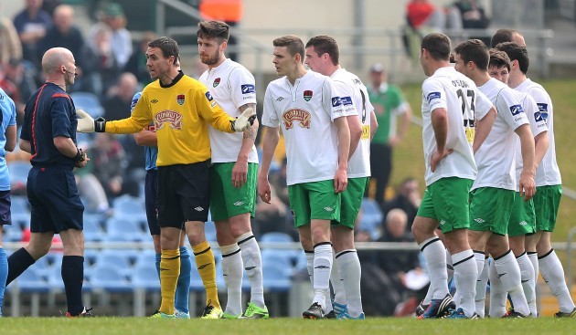 Cork City players lead by goalkeeper Mark McNulty appeal to Padraigh Sutton after he sent off Darren Dennehy