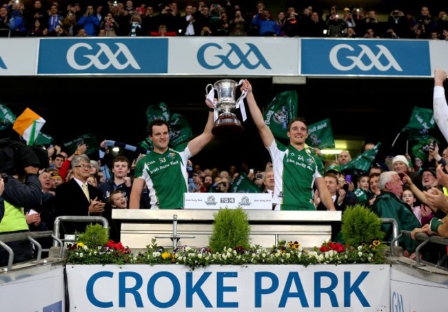 Michael Murphy and Aidan Walsh lift the trophy