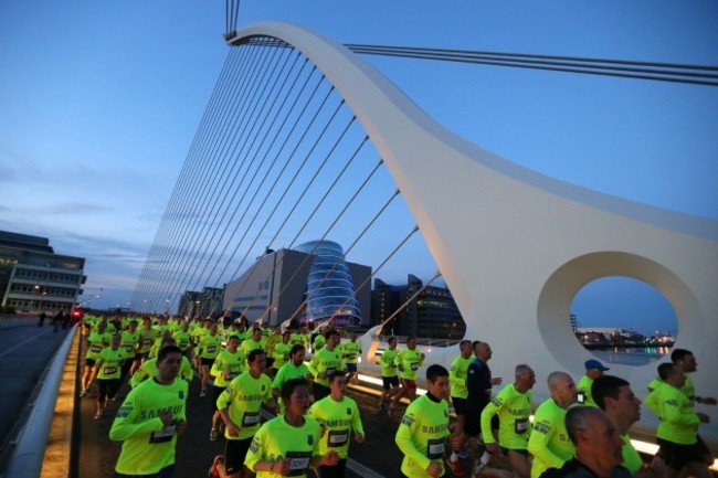 Competitors cross the Samuel Beckett Bridge