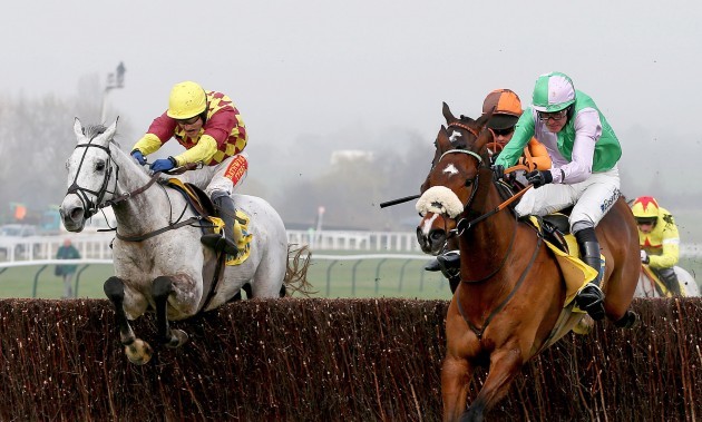 Dynaste ridden by Tom Scudamore (Left) beats Hidden Cyclone ridden by Andrew McNamara on the way to victory