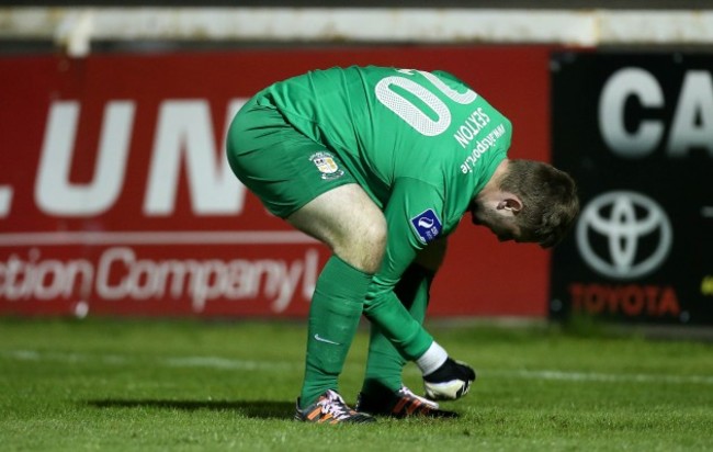 Craig Sexton punches a debit on the pitch after conceding a goal