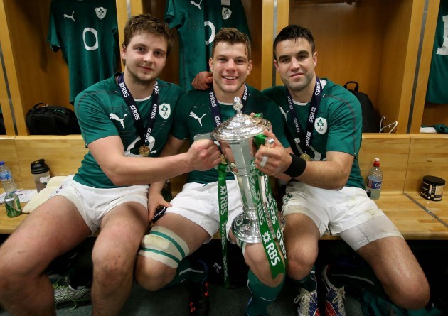 Iain Henderson, Jordi Murphy and Conor Murray celebrate in the dressing room