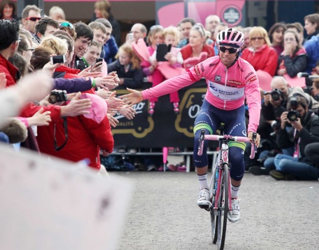 Michael Matthews wears the pink leader's jersey