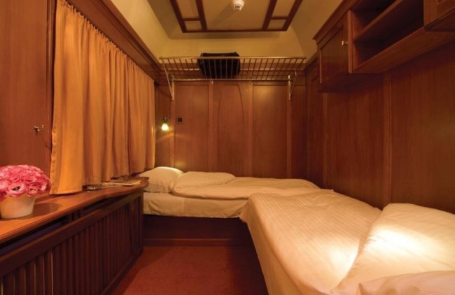the-carriages-have-been-restored-to-their-luster-with-gleaming-wood-paneling-and-comfortable-beds-sleeping-car-attendants-even-bring-tea-or-coffee-in-the-morning-and-wine-late-in-the-evening