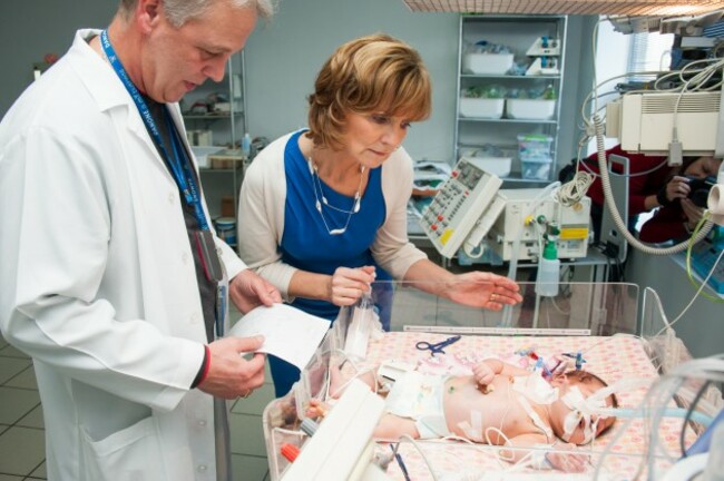 Adi Roche with a child after life-saving Cardiac surgery