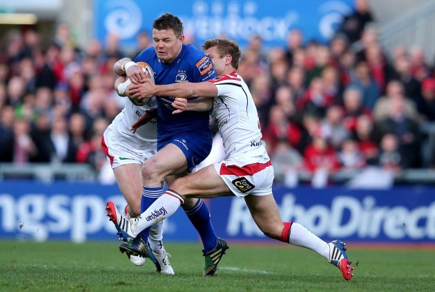 Brian O'Driscoll tackled by Tommy Bowe and Paul Marshall