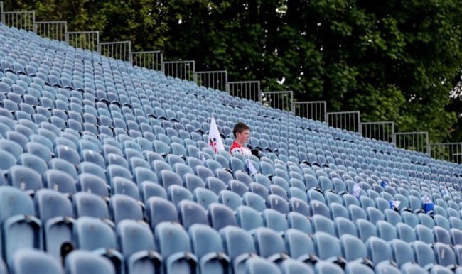 A lone Ulster fans takes his seat