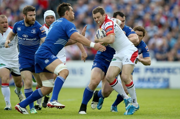 Quinn Roux and Cian Healy tackle Darren Cave