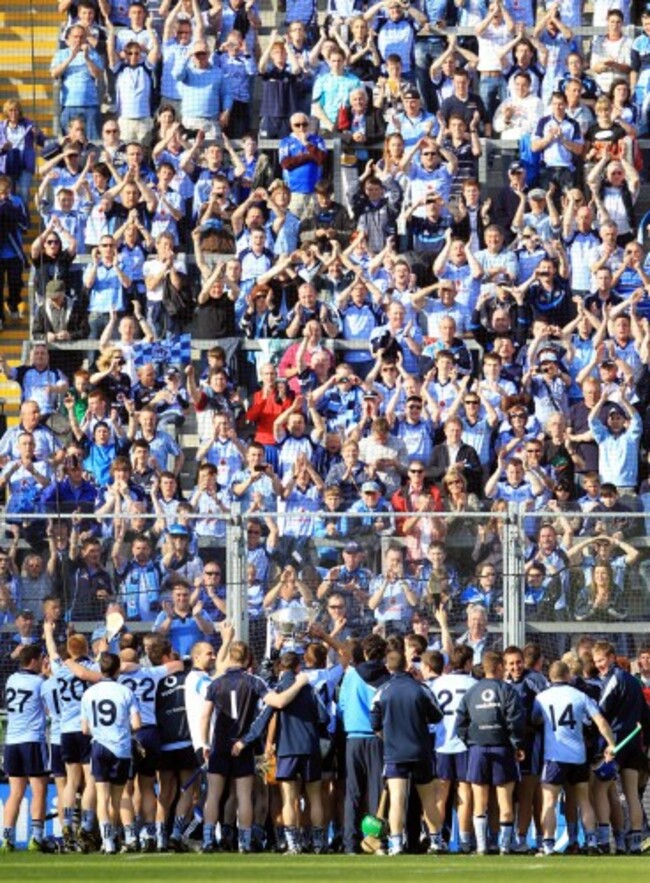 Dublin players celebrate with the trophy in front of their supporters on HIll 16