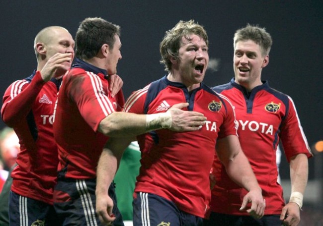 Jerry Flannery celebrates his try with David Wallace and Ronan O'Gara