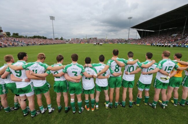 London players stand together for the national anthem