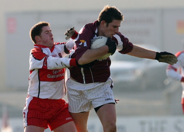 Paul Geraghty is tackled by Conleth Gilligan