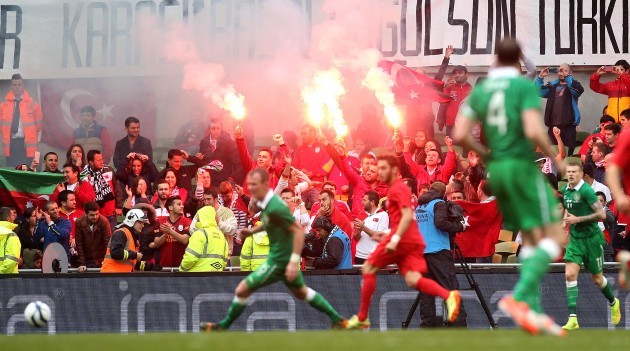 Turkish fans let off flares during the game