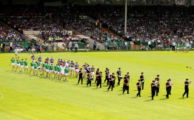 The teams parade before the game