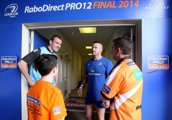 Jamie Heaslip and Al Kellock with referee Nigel Owens and fan Sean Fitzsimons