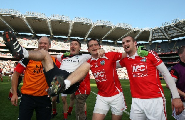 Peter Fitzpatrick celebrates with players Shane Lennon and Paddy Keenan