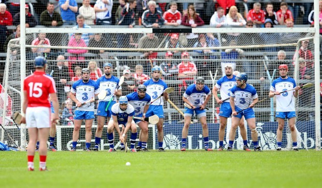 Waterford players defend a Patrick Horgan free