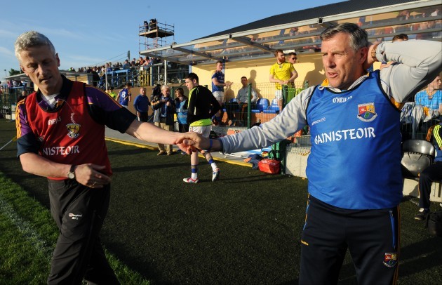 Aidan OÕBrien and Jack Sheedy shake hands at the end of the game