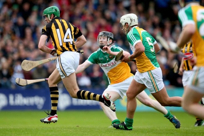 Mark Kelly gets past Niall Wynne and Barry Harding to score his side's third goal