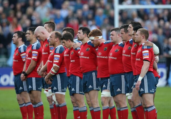Munster team line up for a minutes silence