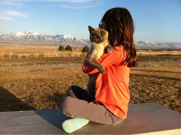 Our daughter and cat on the patio - Imgur