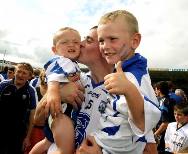 Eoin Kelly celebrates with his two sons