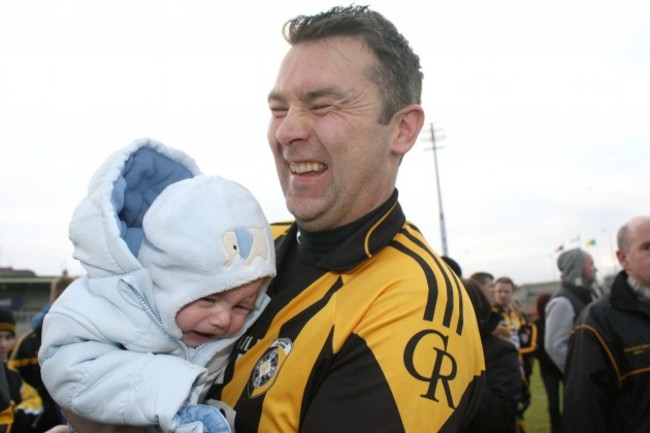 Oisin McConville celebrates with his son Ryan after the game 14/10/2012