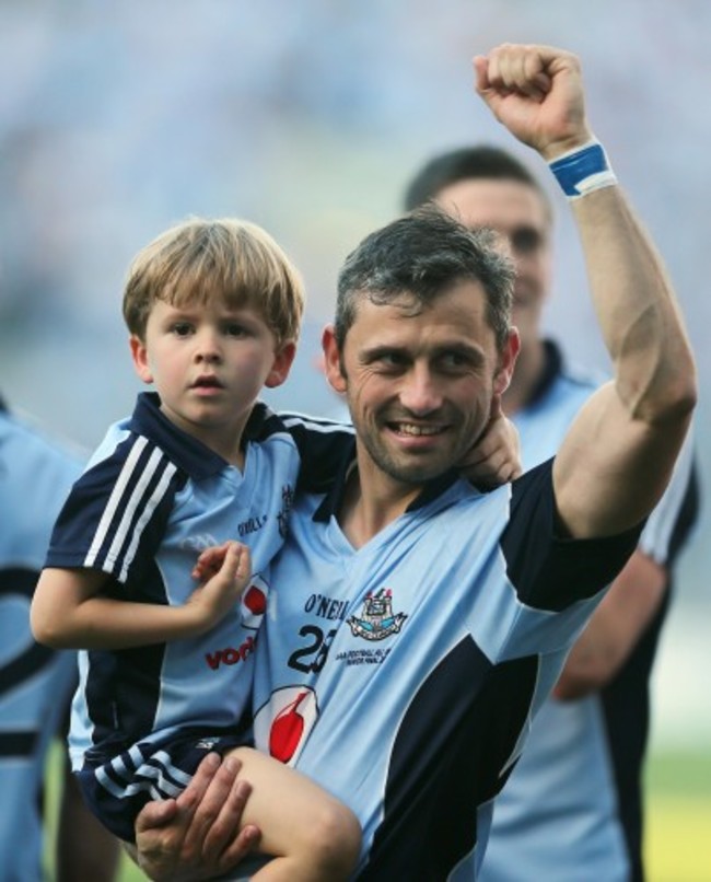 Alan Brogan celebrates after the game with his son Jamie
