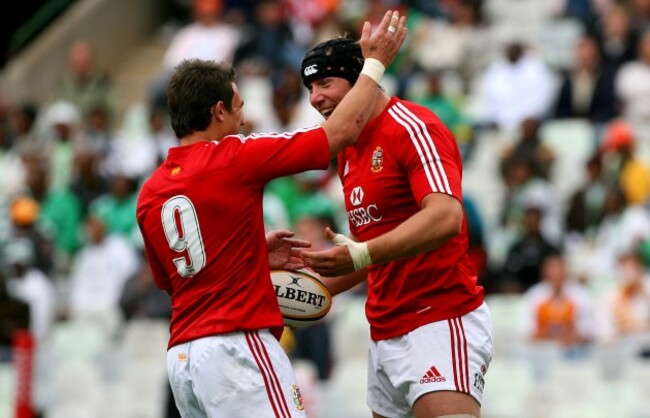 Stephen Ferris celebrates his try with Harry Ellis