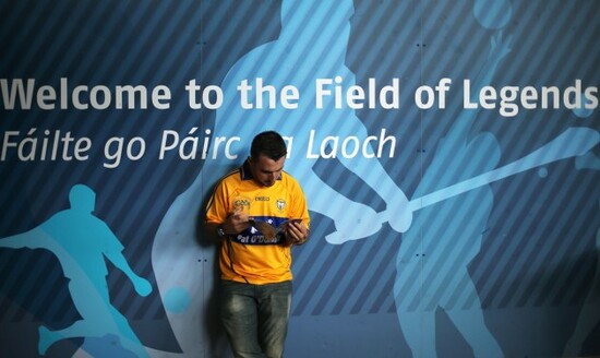 Gerard Culligan studying the match program