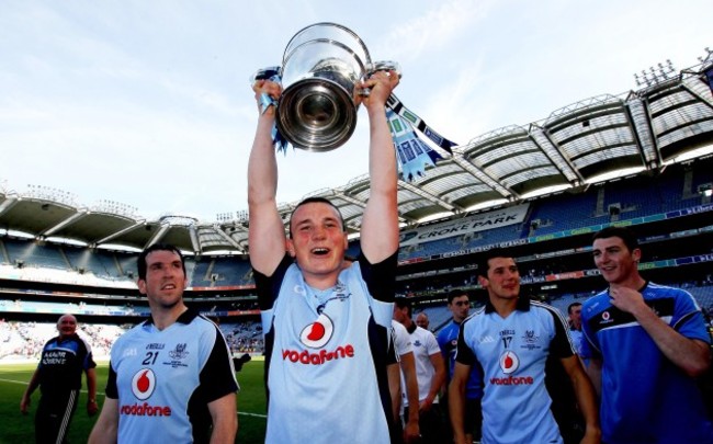 Liam Rushe celebrates with the trophy