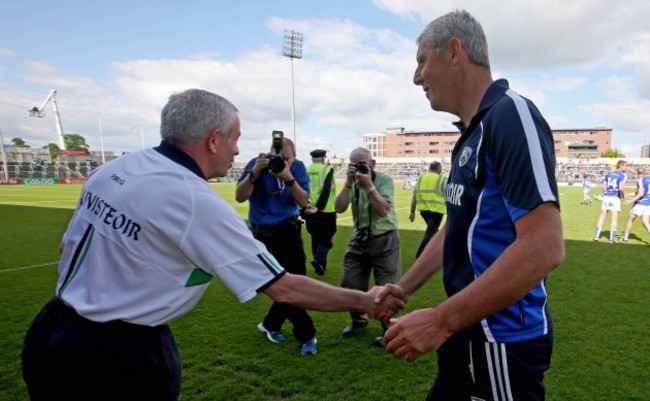 Pete McGrath and Tomas O'Flaharta shake hands at the end of the game