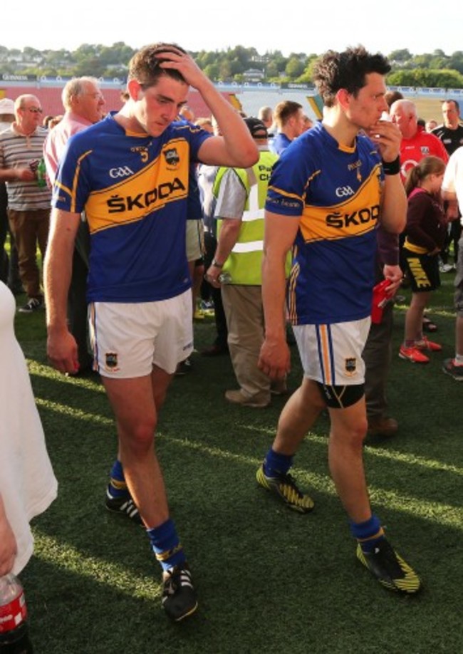 A dejected Colin O'Riordan and Ciaran McDonald