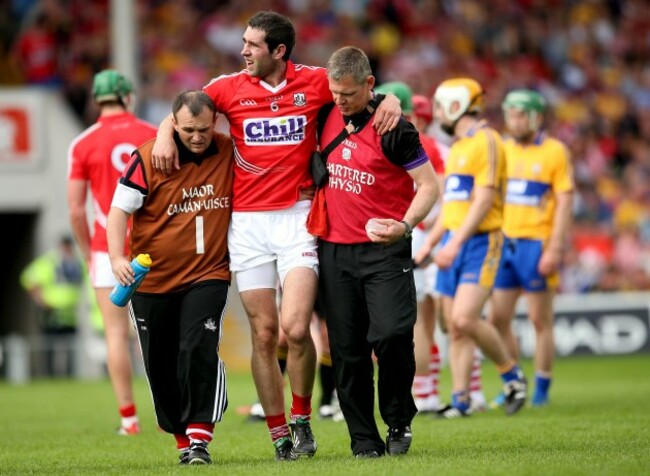 Mark Ellis leaves the field injured